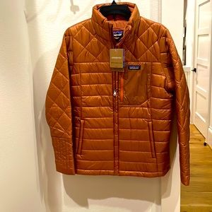 Brand new (never worn) women’s rust color Patagonia Radalie jacket .